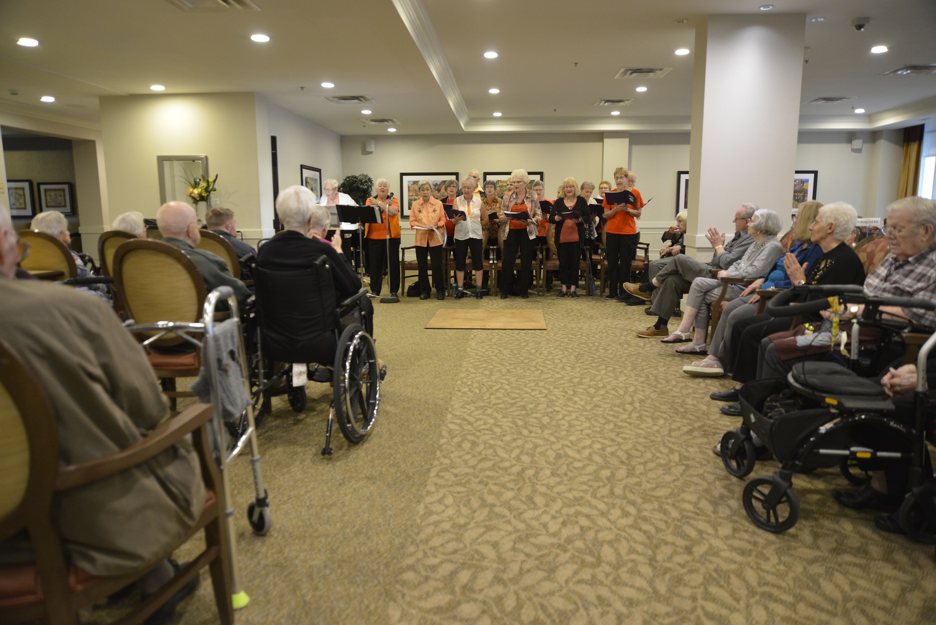 Residents of College Park II, a retirement residence, are entertained by a local choir. A landmark 2013 study by the Montreal Neurological Institute showed clearly the benefits music has on the brain. Photo by Don Hall