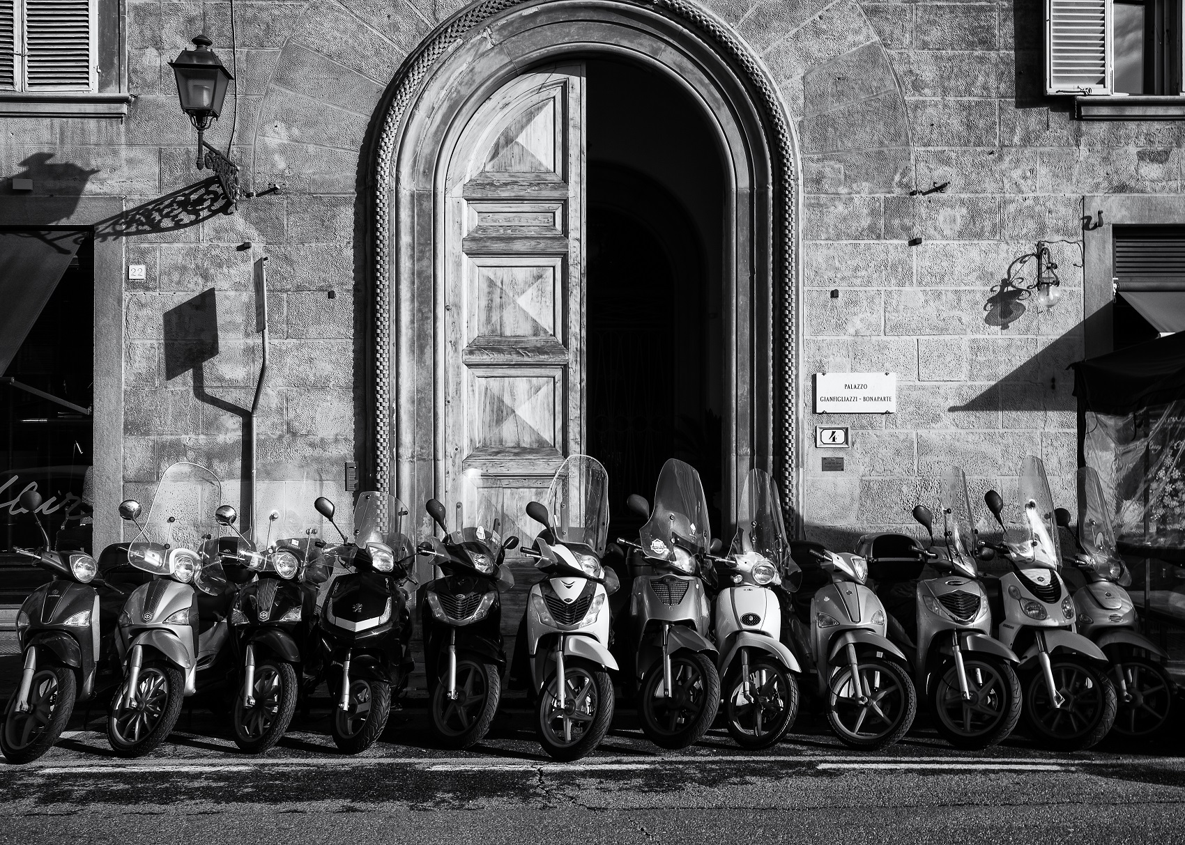 <small>Scooters line a street
in Florence.</small>