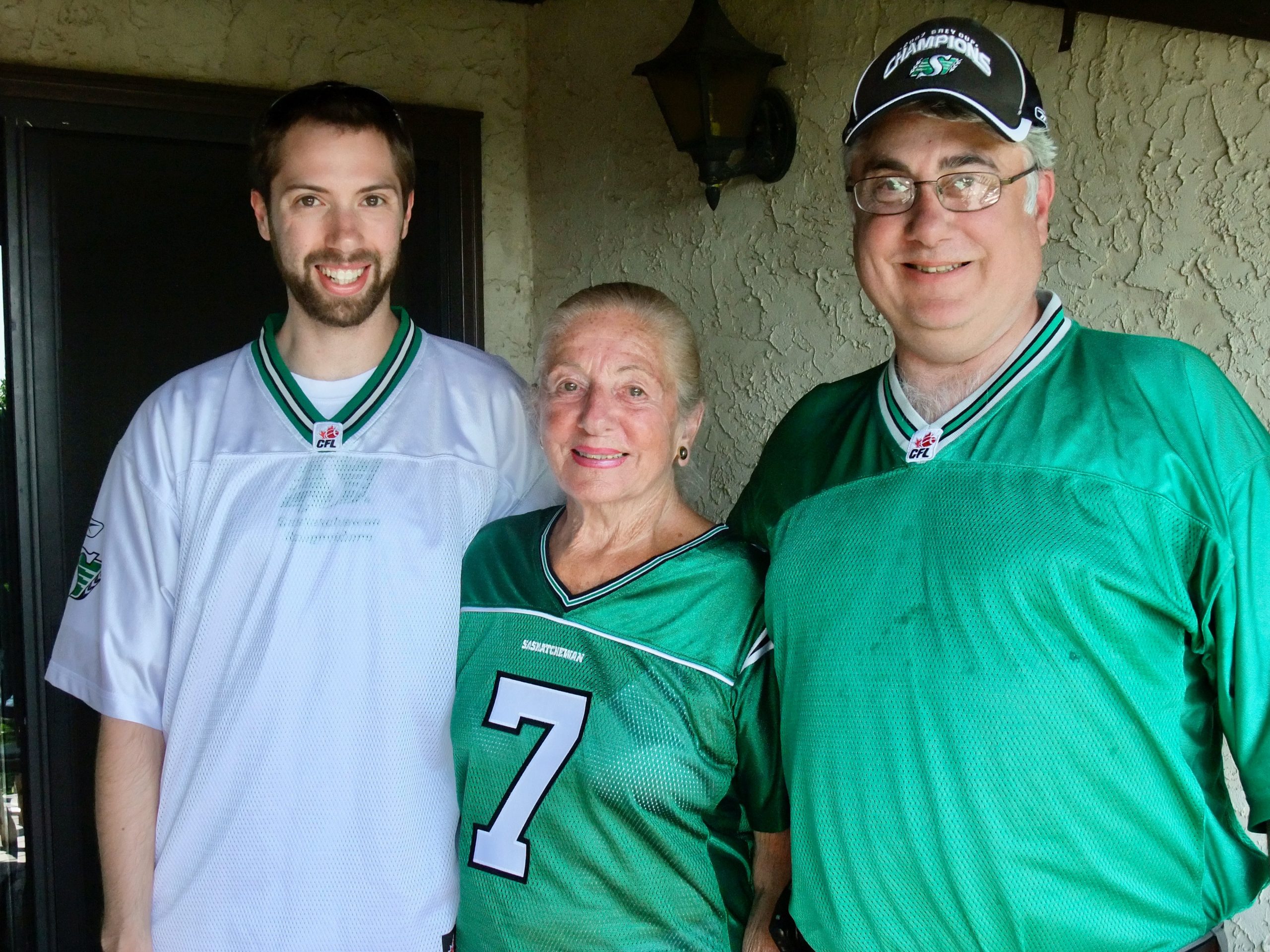 Lydia was a great Riders fan and she and her husband, Donald, had season tickets for close 60 years. Fandom is a family trait. This photo was taken July 25, 2009 – a day before her birthday – and the day of a Riders game that she went to with me, her grandson, Duncan (left) and son Jack. Both of whom are also UofR alumni. 