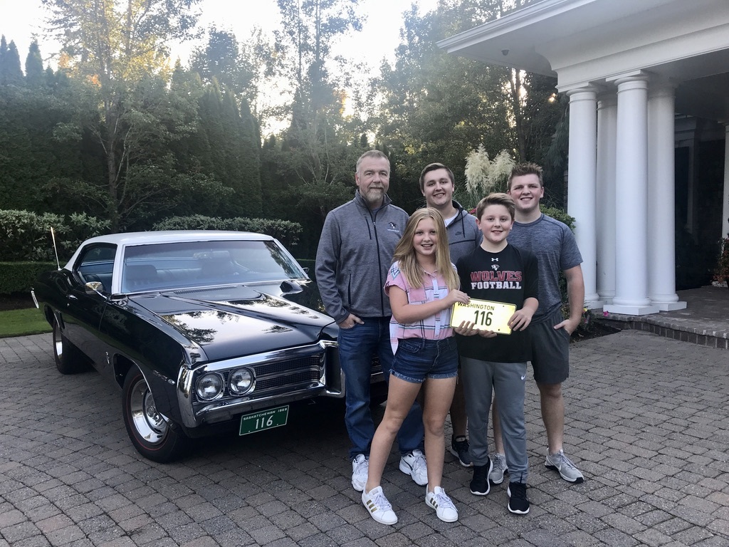 The Plummer clan in front of the Parisienne 2+2 that Dave's father bought new in 1969. Dave acquired it in 1984 and used it as a daily driver. Note the Saskatchewan front plate. From left to right: Dave, Brooklyn, Eric, Steven, and Andrew.
