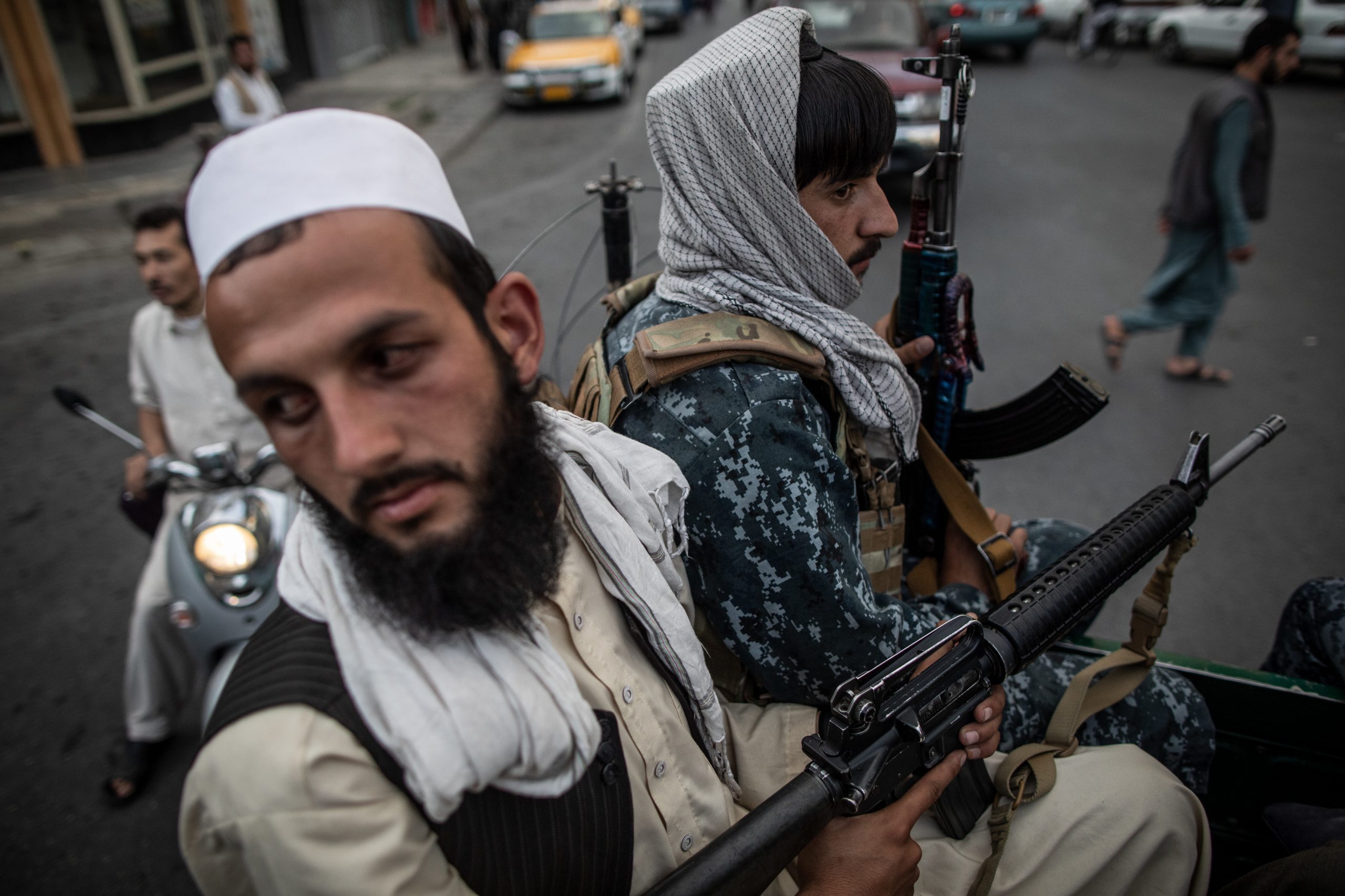 22 September 2021, Afghanistan, Kabul: Young Taliban fighters on the back of a pick up truck patrol on the streets of Kabul. (Credit Image: © Oliver Weiken/dpa via ZUMA Press)