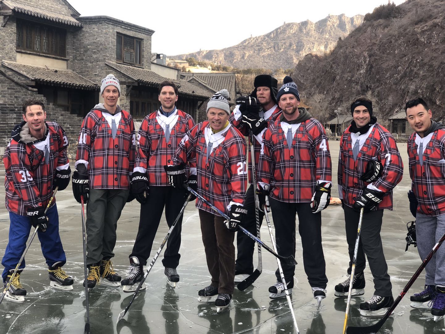 Nickel (centre #20) poses with Team Canada teammates during a 2019 pond hockey tournament at the Great Wall of China.