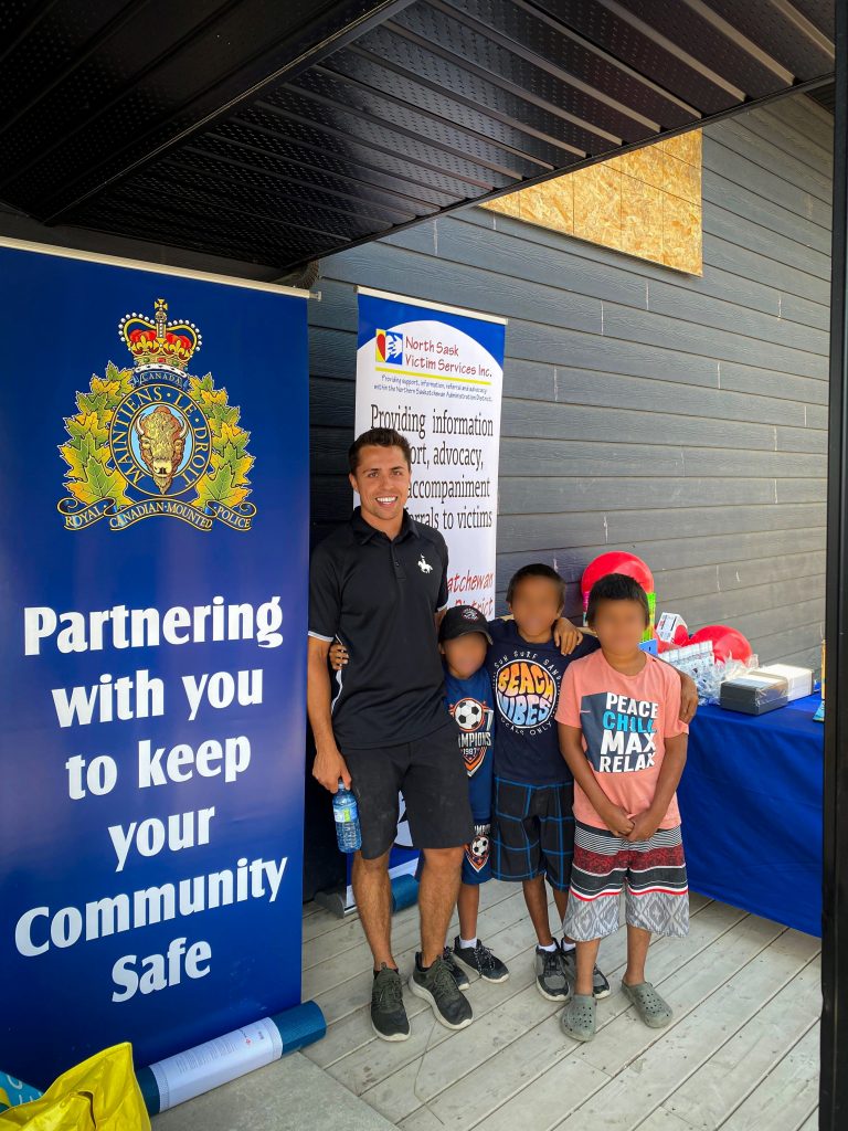 One of Arndt's favourite things is building relationships with youth in northern communities. Arndt is seen here with kids from Pelican Narrows. 
