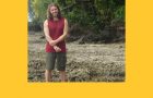 Smiling individual in field