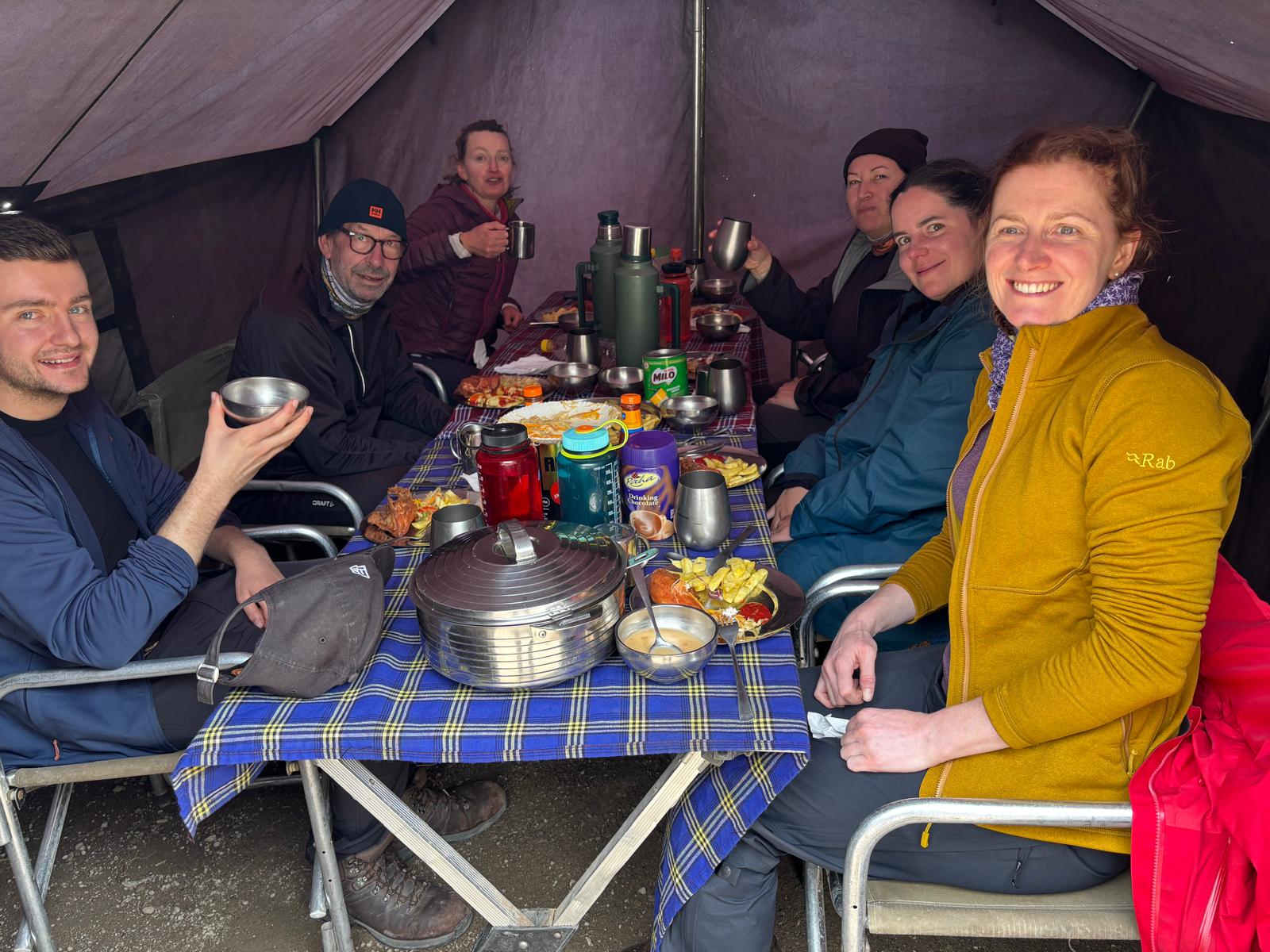 0600b468-cc06-449c-af11-939cd0708f97 At the end of a difficult day of hiking, the group could always rely on a hearty meal and some welcome social time in the mess tent.