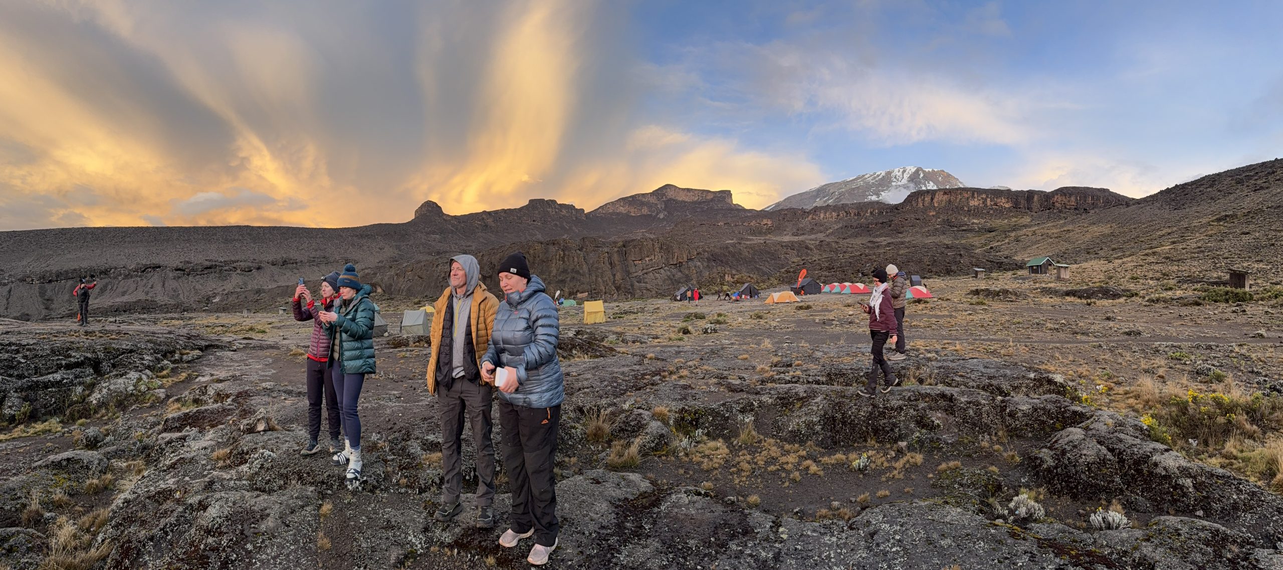 IMG_0710 (1) Members of InZania gather for photos of a glorious sunset while the summit of Kilimanjaro can be seen in the background.