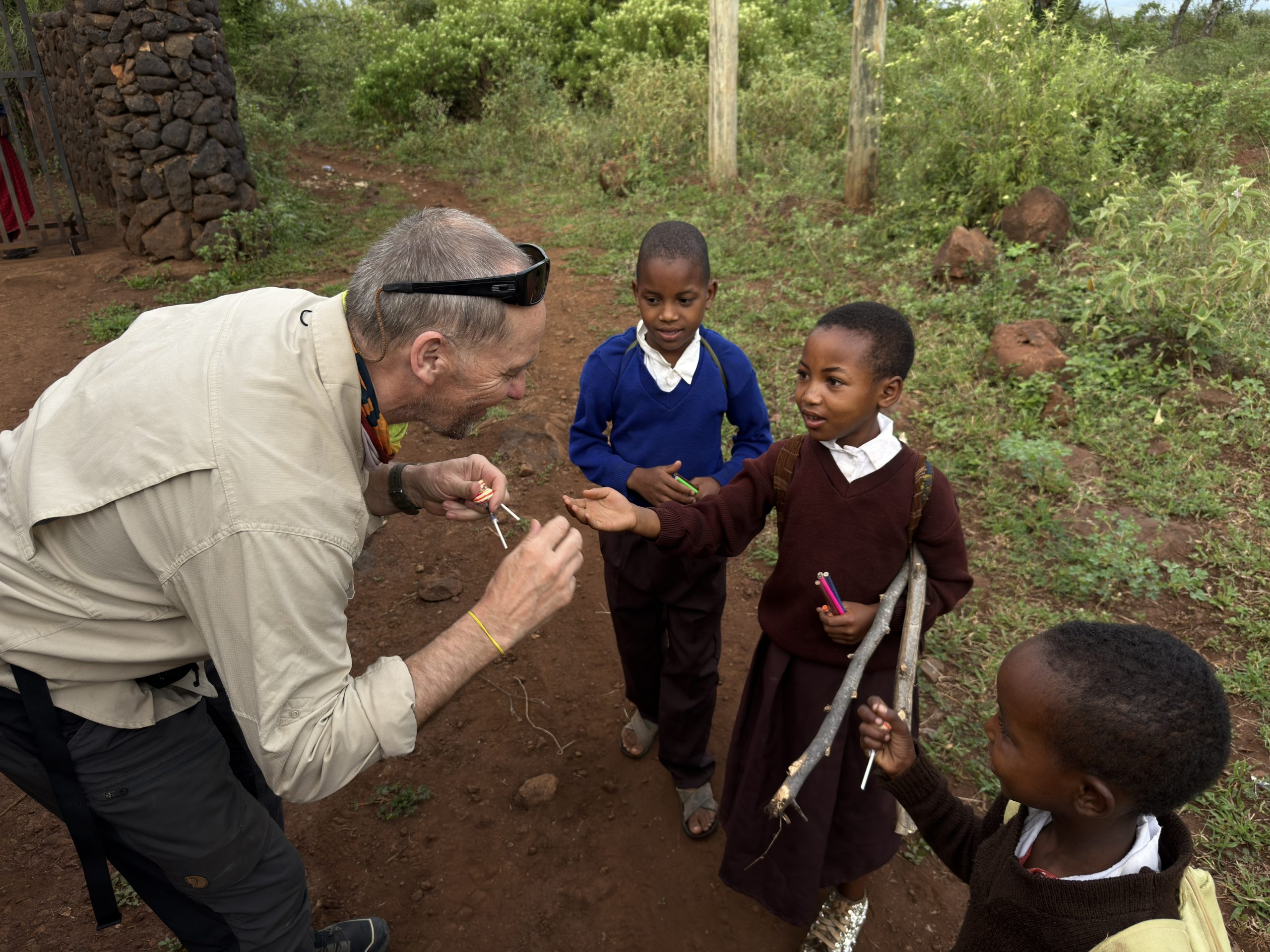 IMG_2371 Asselin hands out treats and school supplies during his visit to Tanzania to climb Mount Kilimanjaro.