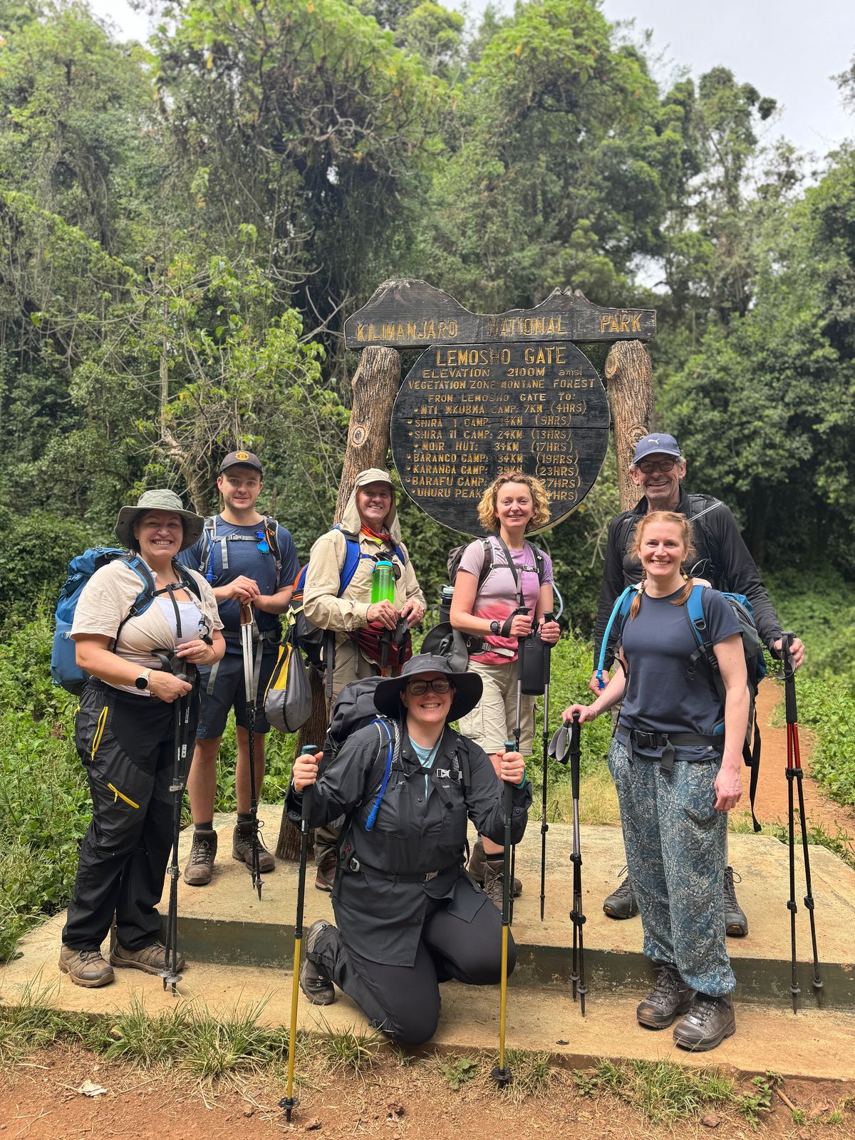 dac54945-b5d5-4292-a3d7-2ac5c277b511 The seven trekkers of InZania, including Asselin and Campbell, at the Lemosho Gate, the start of their Kilimanjaro odyessy.