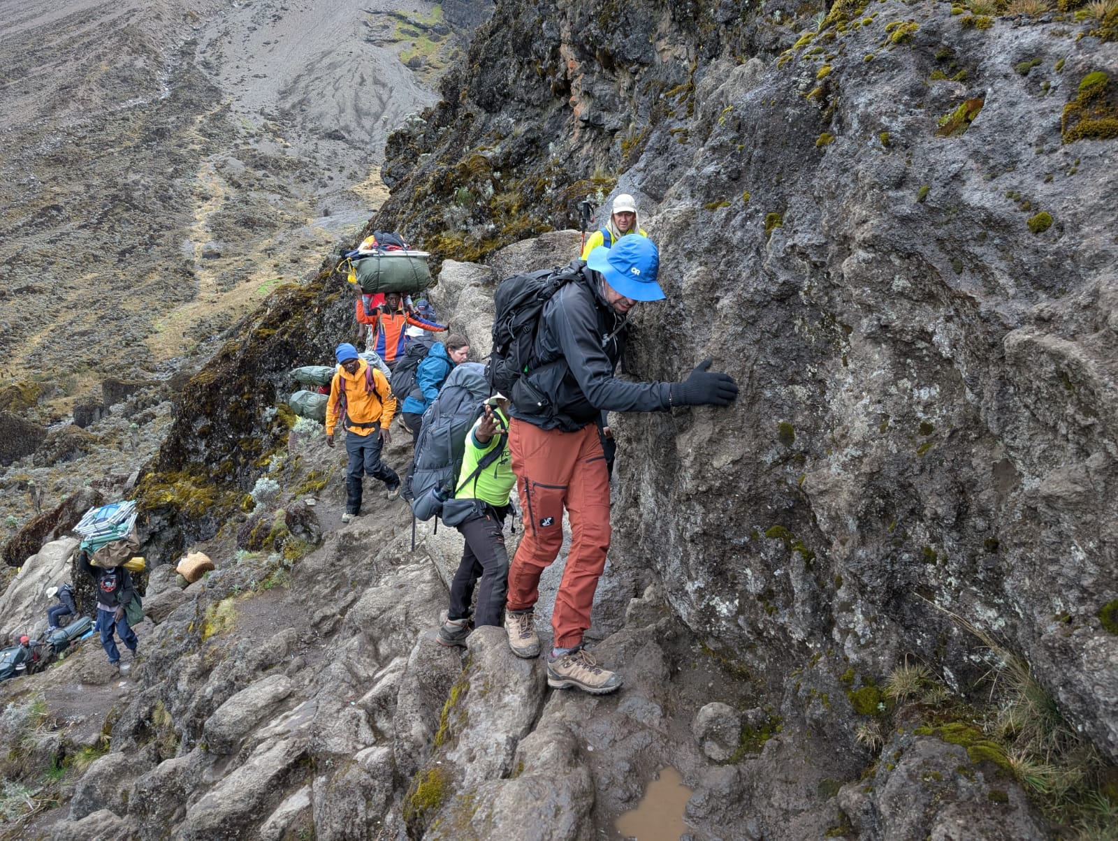 51e0623c-cb32-460d-8cb4-9f3be2e38006 The author navigates the Barranco Wall, or Death Wall as it's sometimes known. Hikers on the Lemosho Route scramble up the 250-metre wall on day five of an eight day trek.