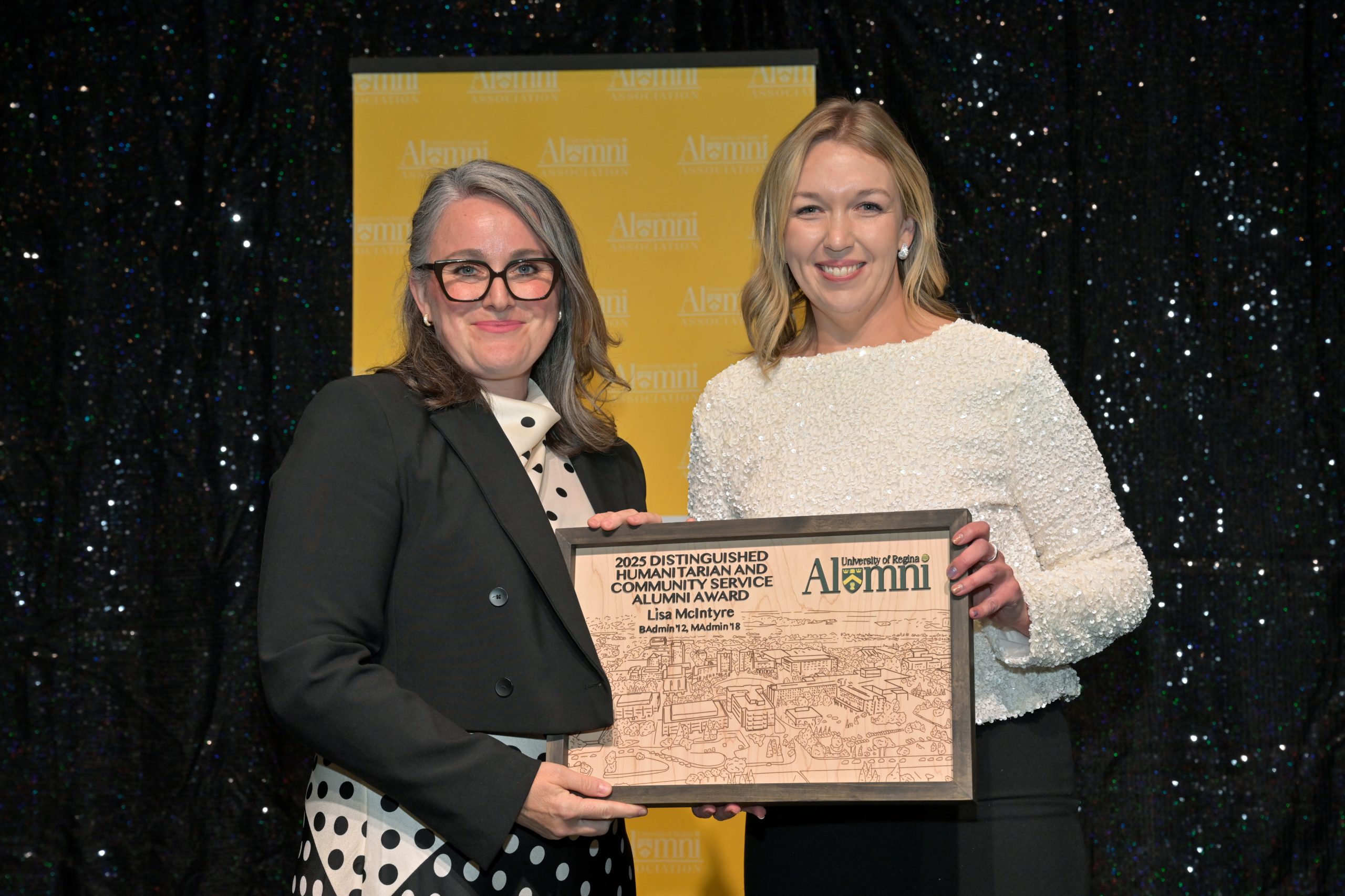 Two smiling individuals