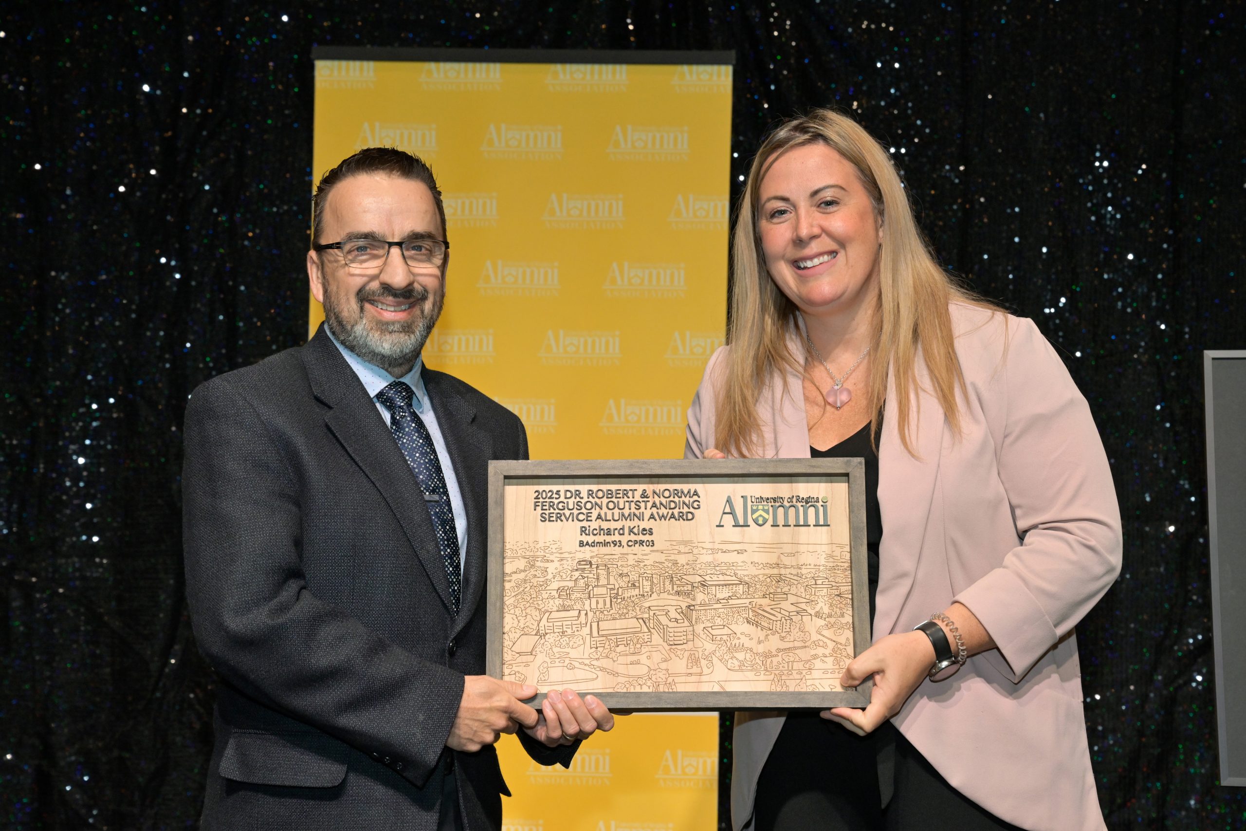 Two smiling individuals