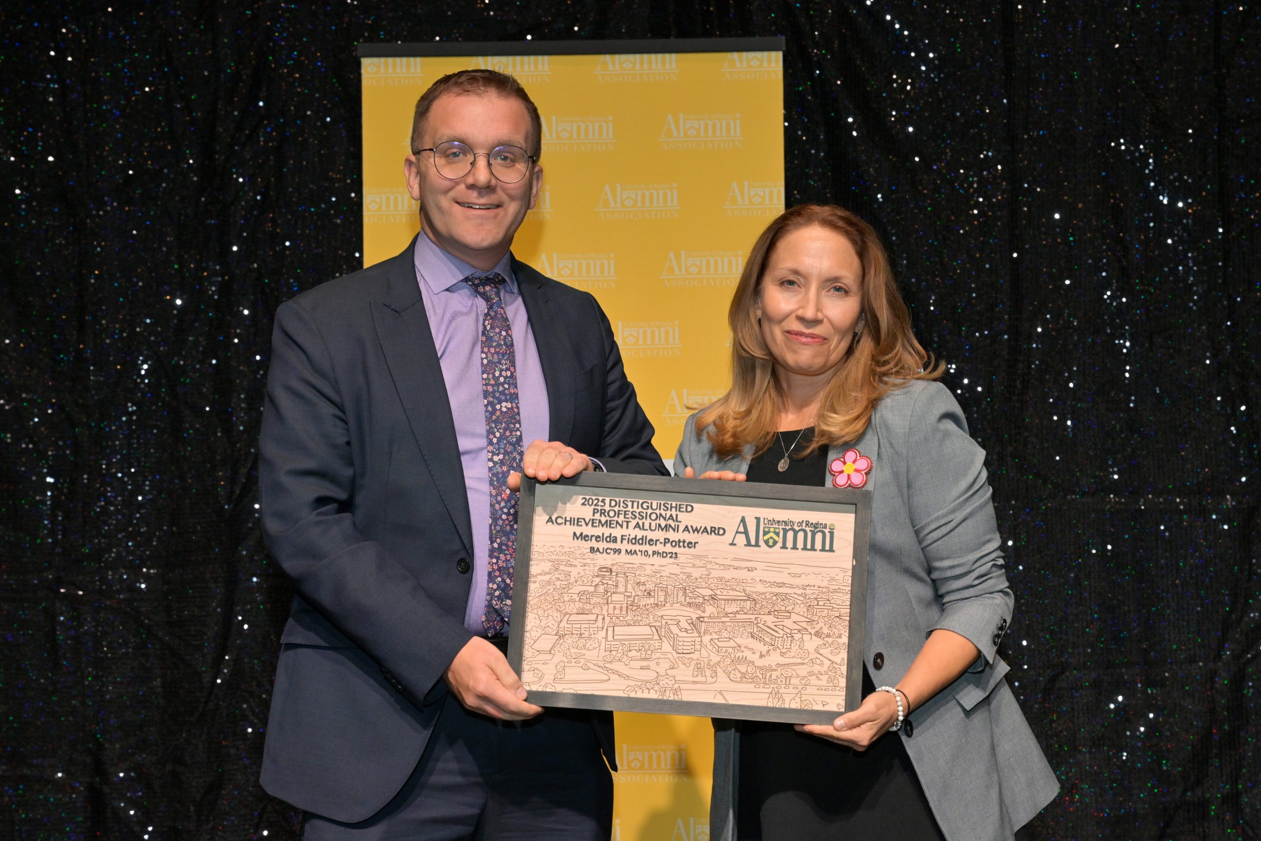 Two smiling individuals