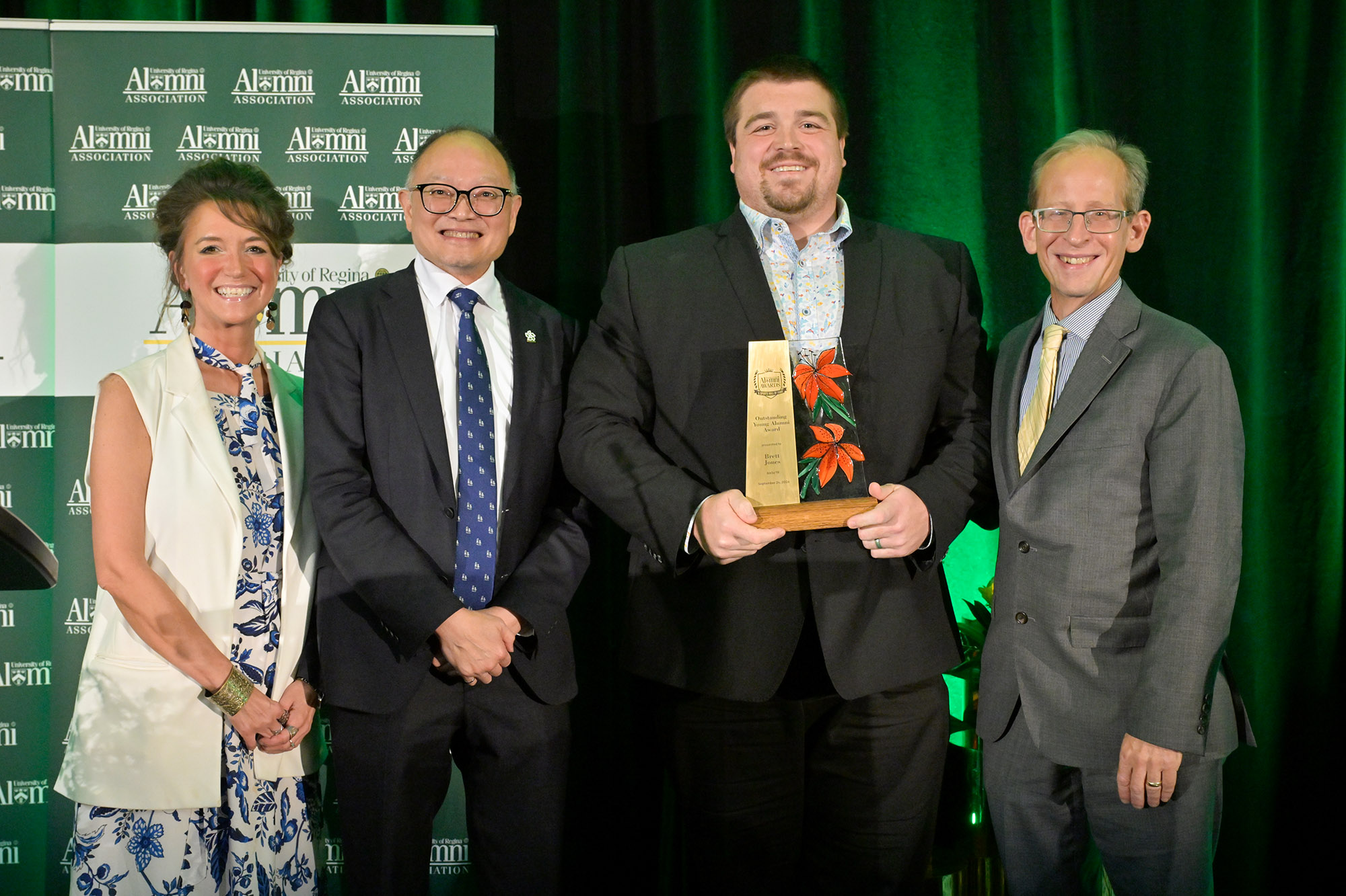 Brett Jones BASc'19  accepts Young Alumni Award, pictured with (l-r) Jennifer Murray, Dr. Phillip Choi, Dean, Faculty of Engineering and Applied Science; and Dr. Jeff Keshen.