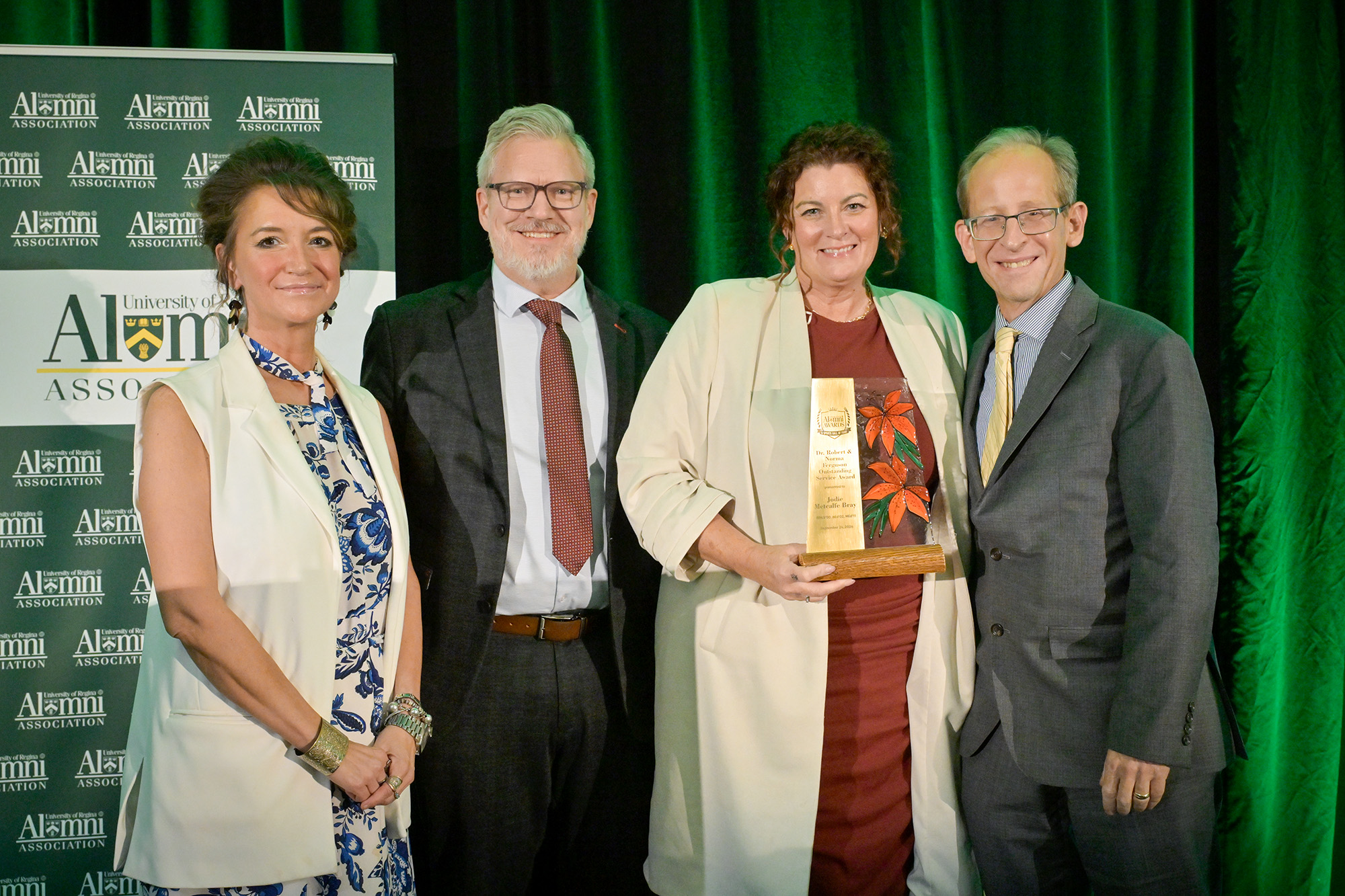 Jodie Metcalfe Bray BPAS'00, BEd'02, MEd'11 accepts Dr. Robert & Norma Ferguson Outstanding Service Award, pictured with Jennifer Murray, President, URAA; Dr. James Nahachewsky, Dean, Faculty of Education; and Dr. Jeff Keshen.