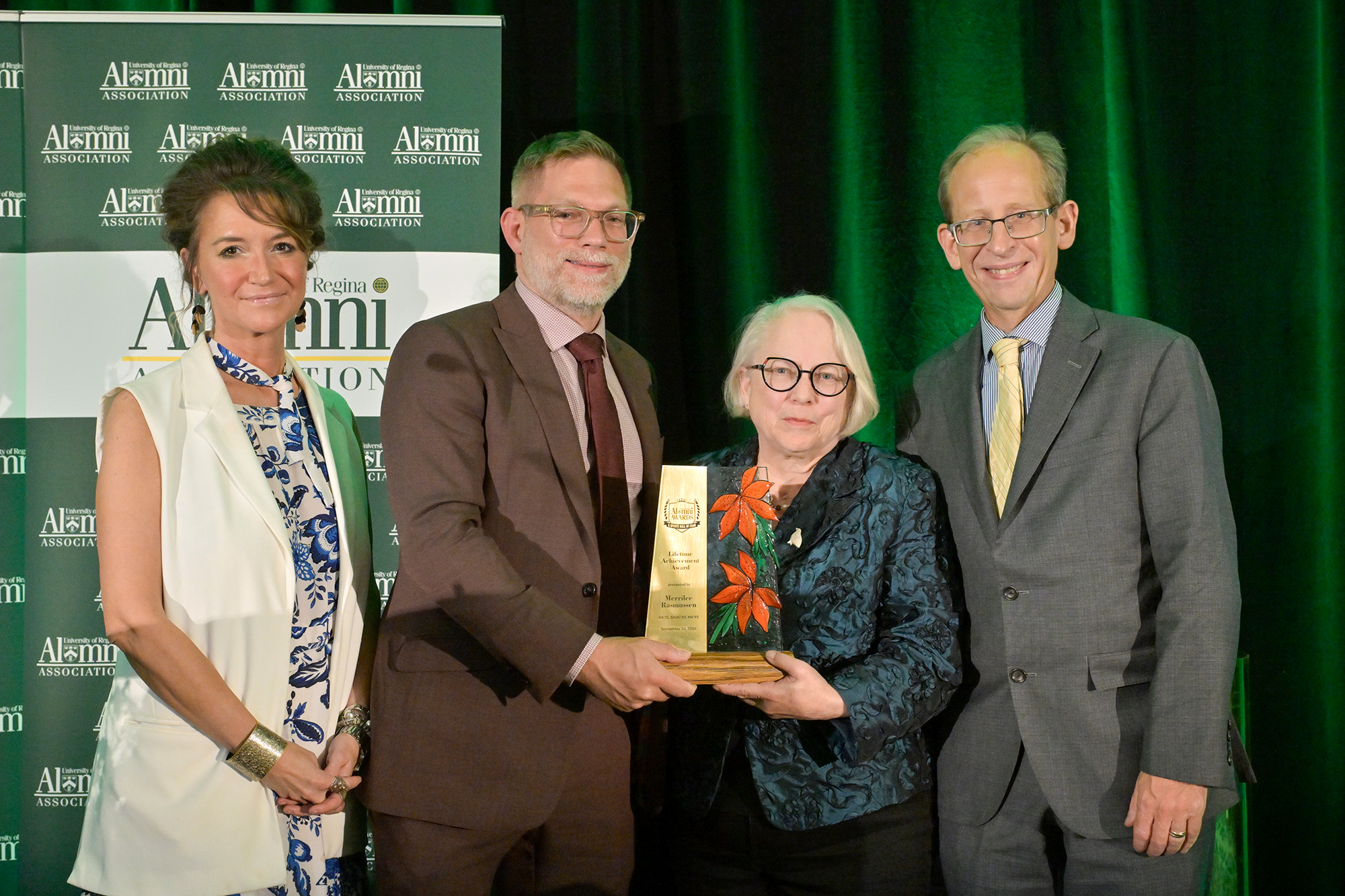 Merrilee Rasmussen BA'72, BAHC'89, MA'95 accepts Lifetime Achievement Award, pictured with (l-r) Jennifer Murray, President, URAA; Dr. Tobias Sperlich, Interim Dean, Faculty of Arts; Dr. Jeff Keshen.