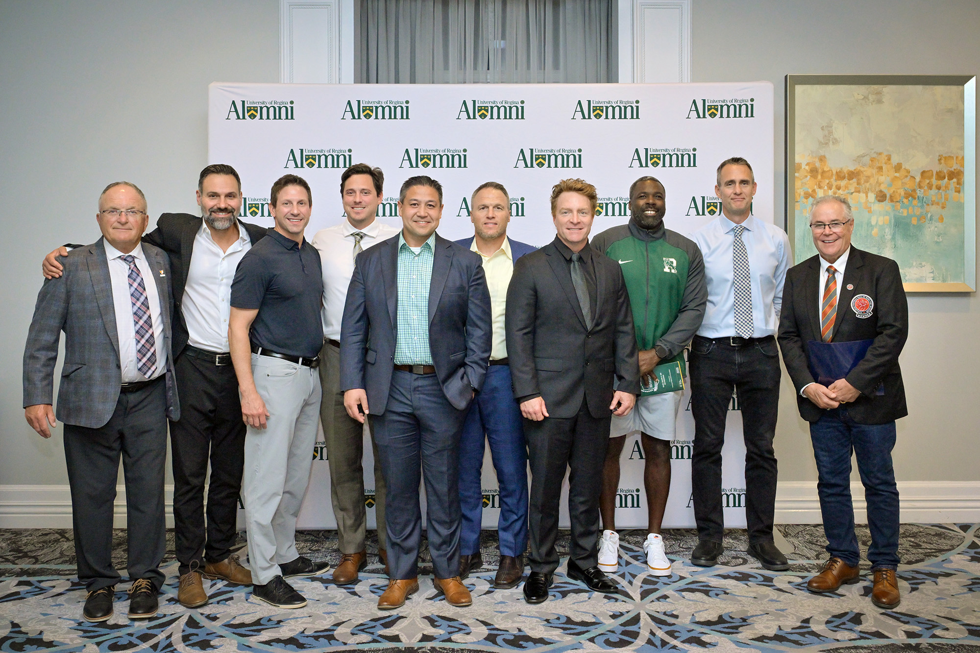 Members of the 2000 Rams team and coaching staff.